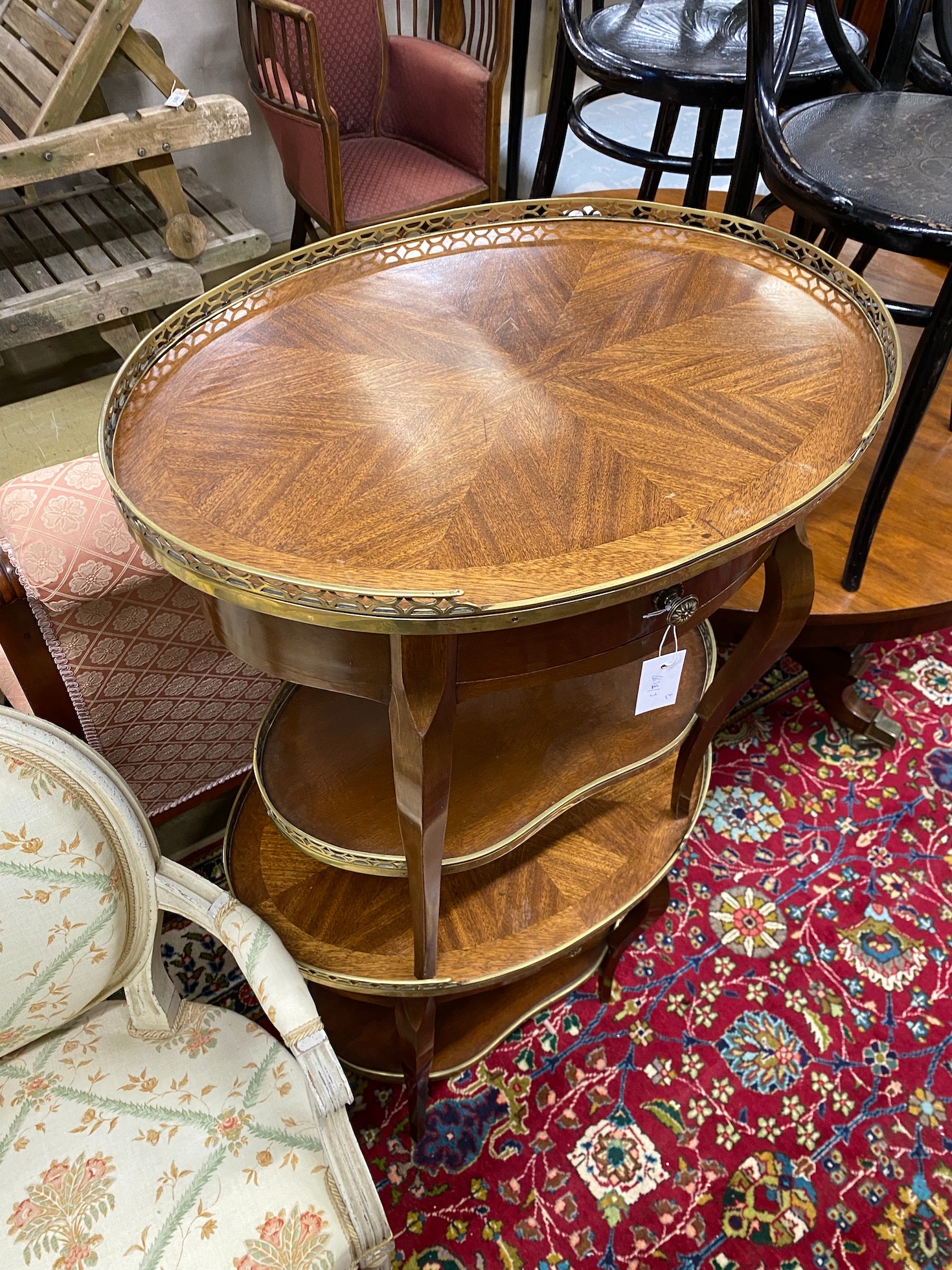 A pair of French style glass mounted mahogany oval occasional tables, width 54cm, height 62cm